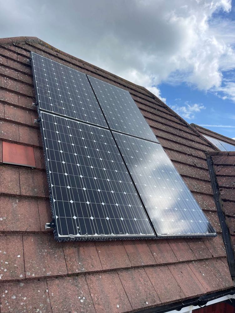 Solar panels on a tiled roof protected from nesting pigeons